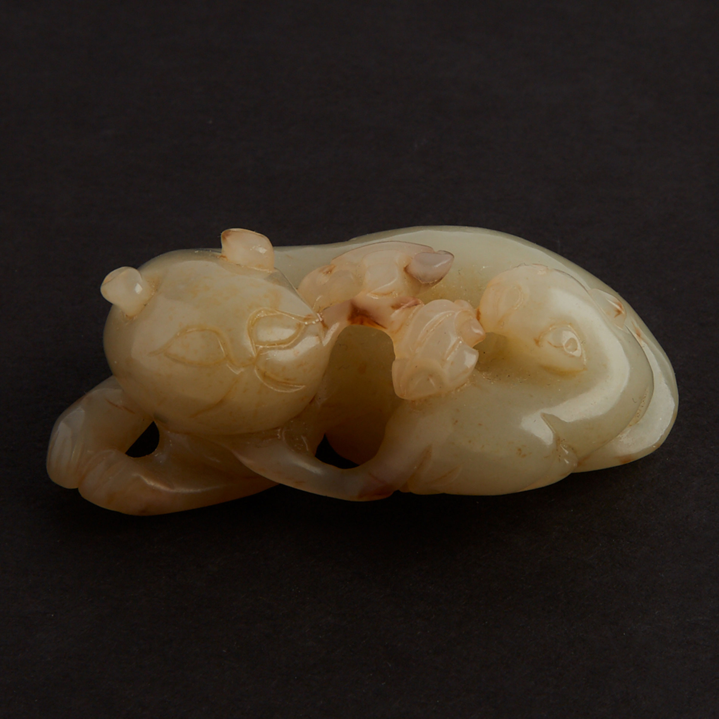 A Celadon Jade Carving of Two Cats