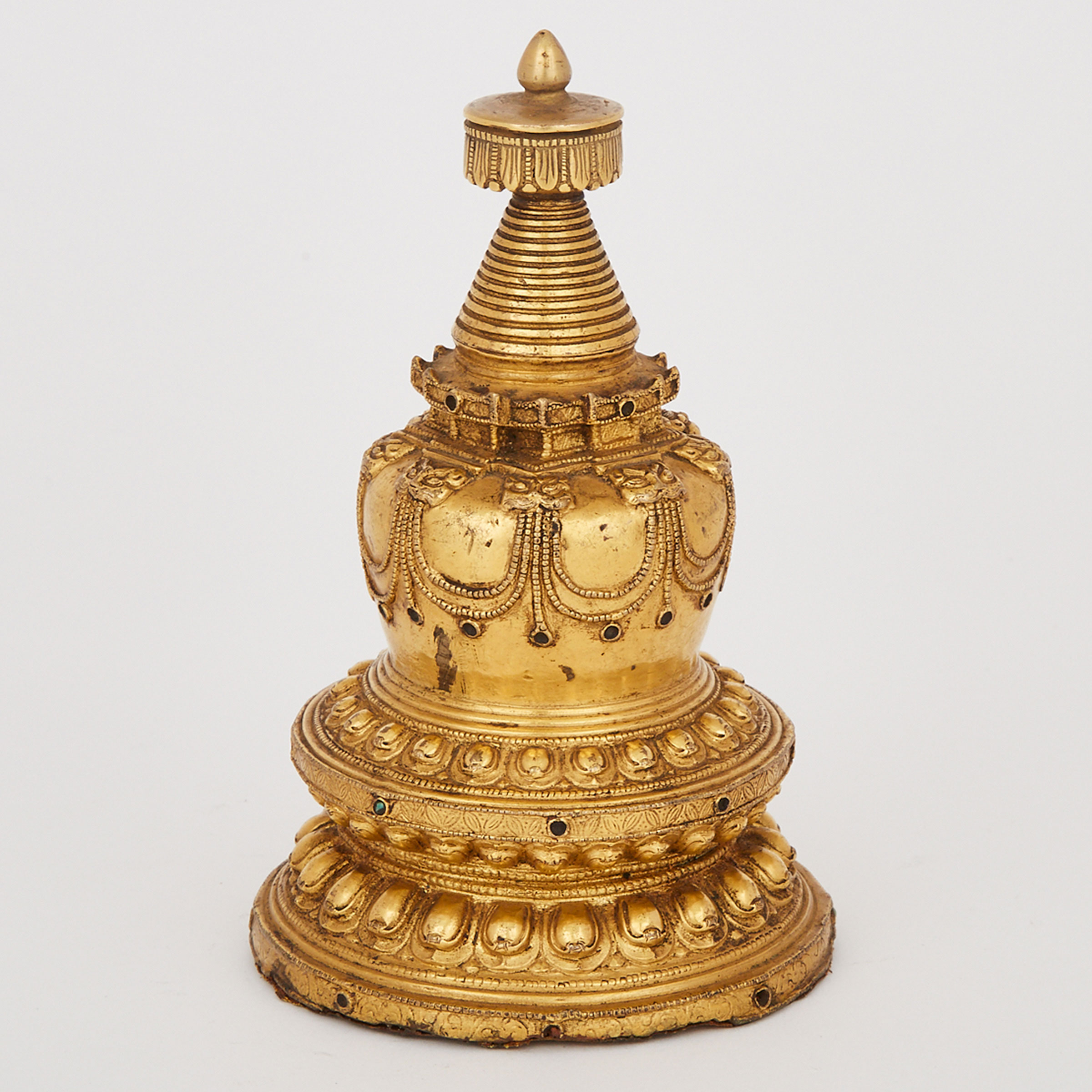 A Tibetan Gilt Bronze Stupa