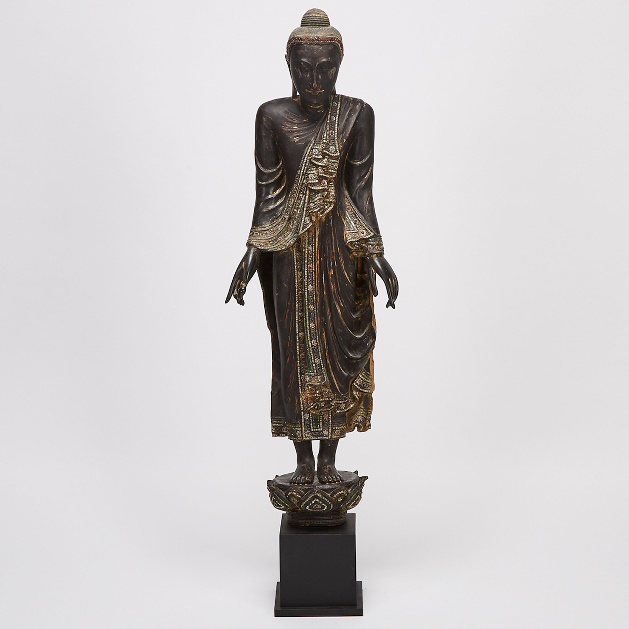 A Standing Black Lacquer Wood Buddha, Mandalay Period, Burma, 19th Century
