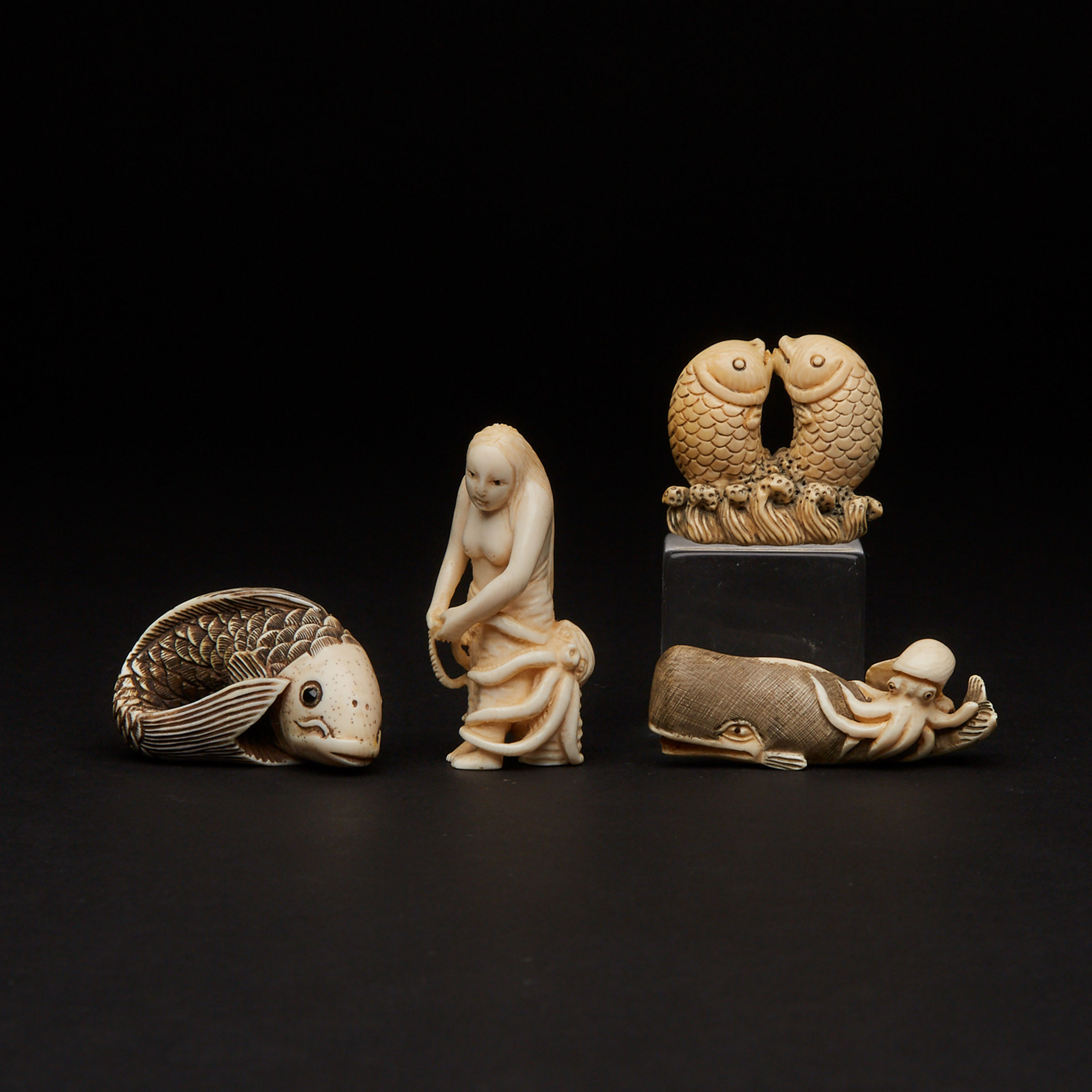 A Group of Four Ivory Carved Sea Animal Netsuke 