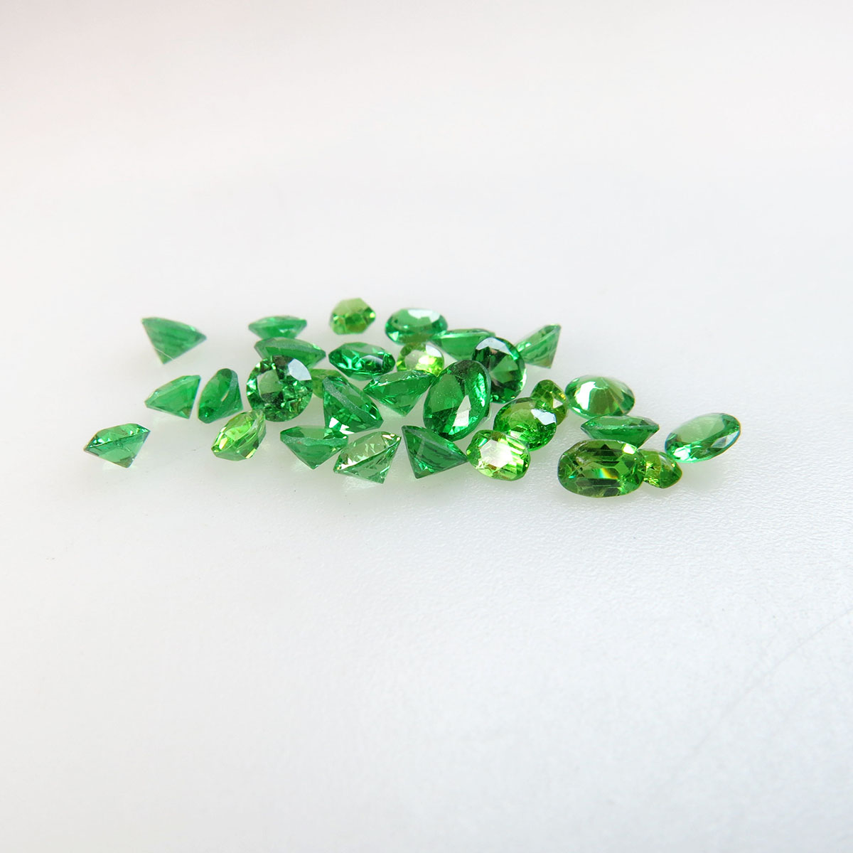 30 Round And Oval Cut Demantoid Garnets