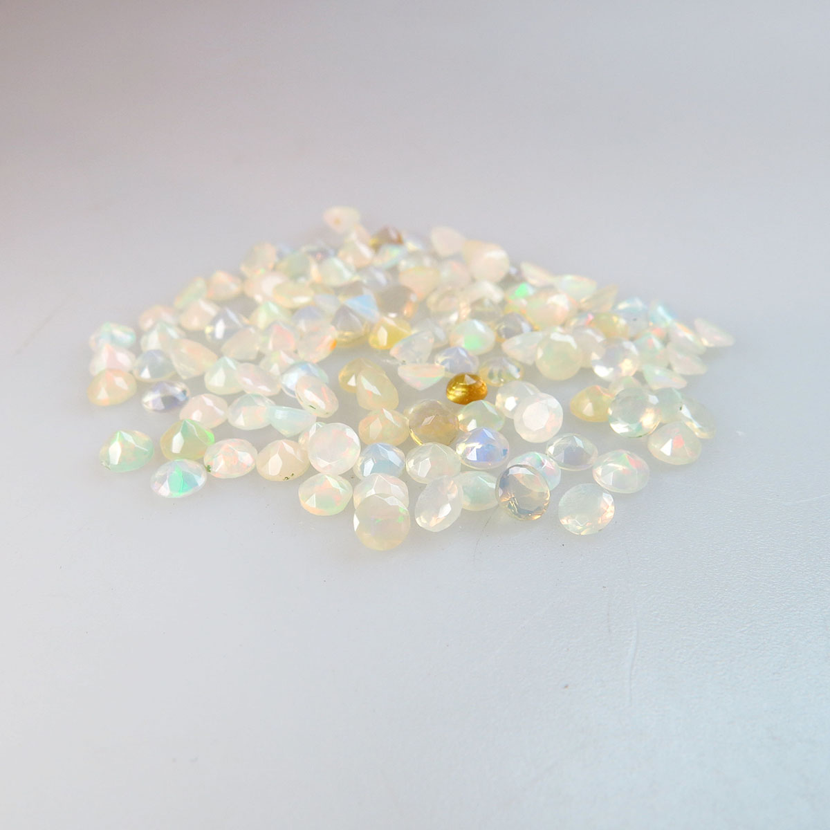 124 Round Cut Faceted Opals