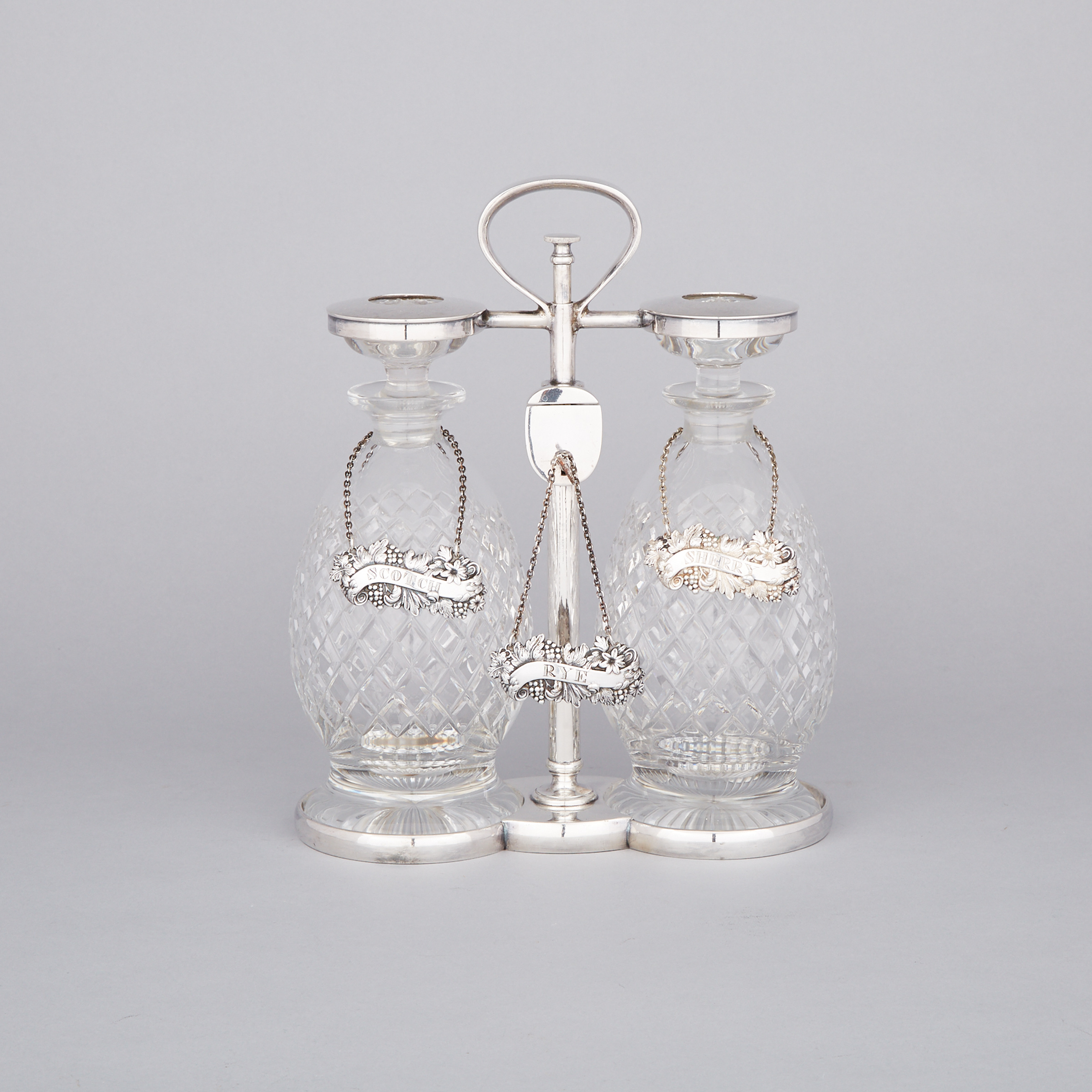 English Silver Plated and Cut Glass Two-Bottle Tantalus, Hukin & Heath, early 20th century