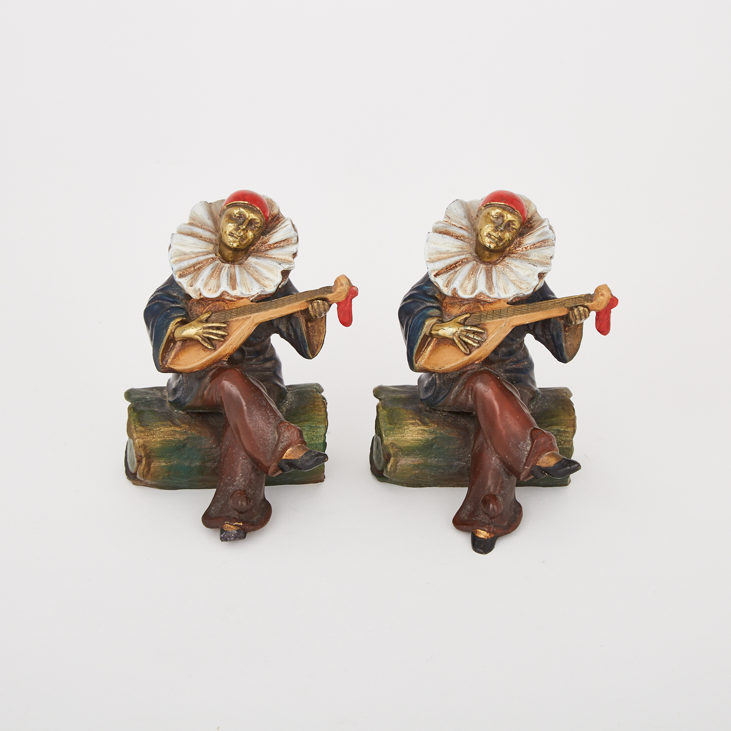 Pair of Austrian Gilt and Cold Painted Metal Minstrel Form Figural Bookends, early 20th century
