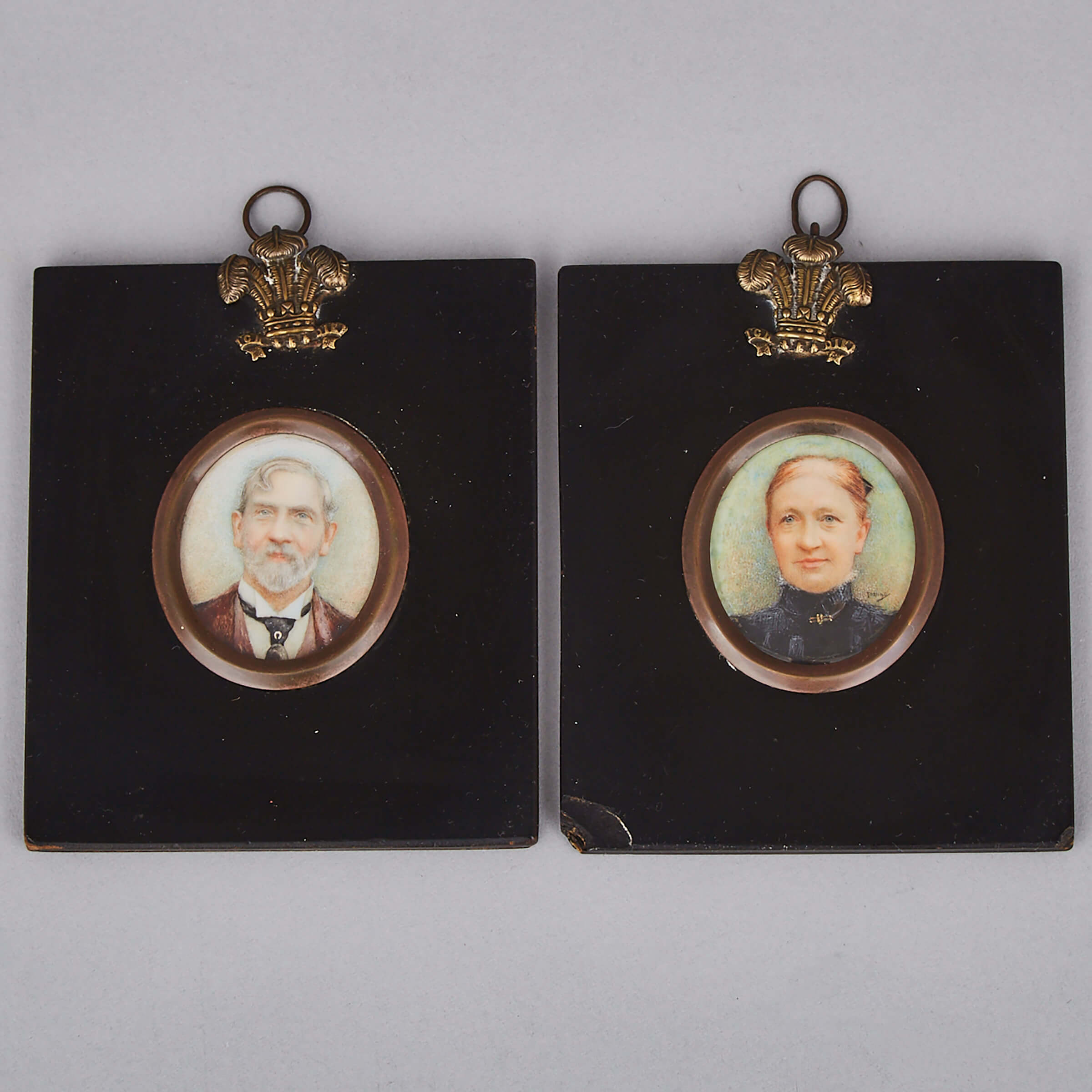 Pair of British School Portrait Miniatures of a Gentleman and a Gentlewoman, mid 19th century