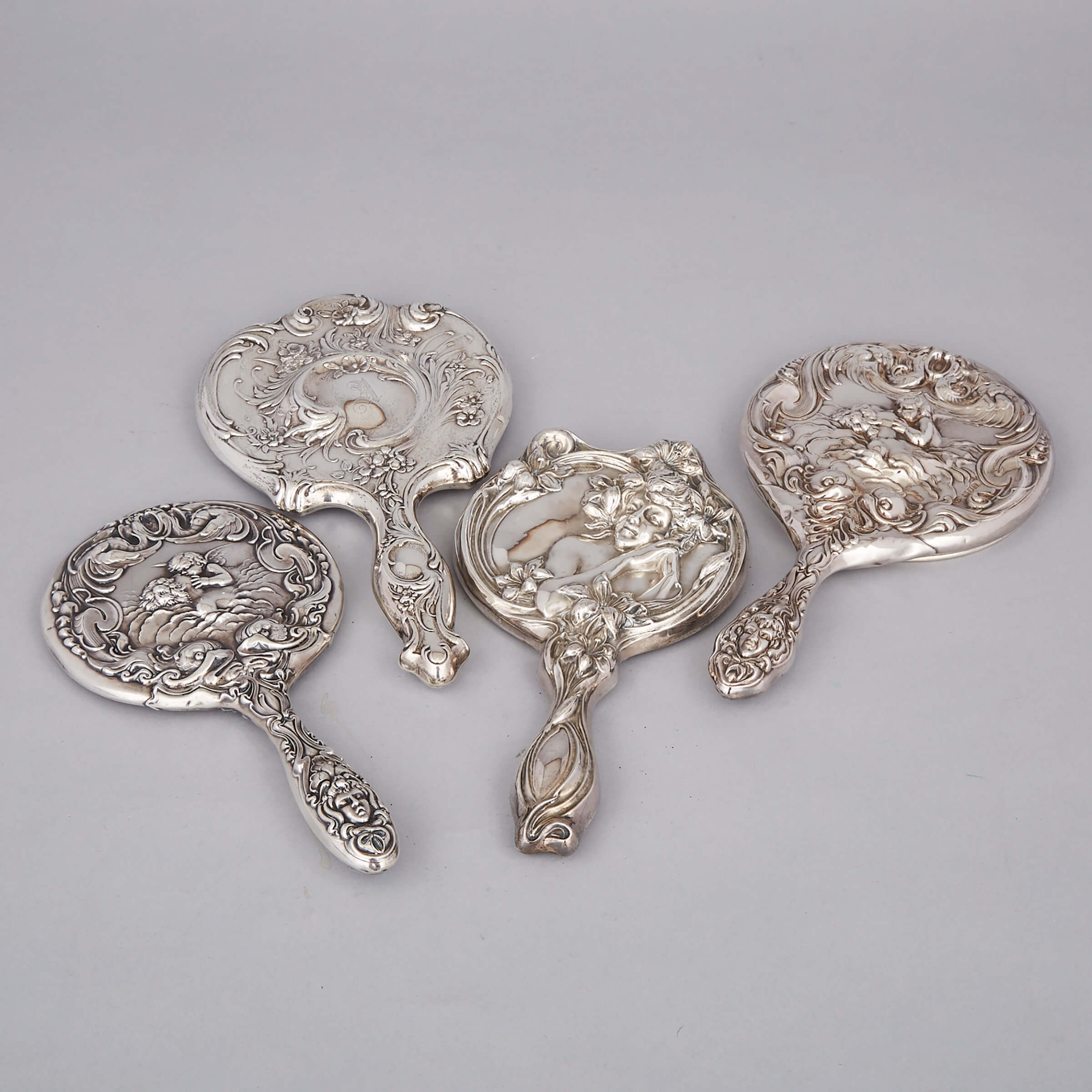 Four Edwardian and North American Silver Hand Mirrors, c.1900-10