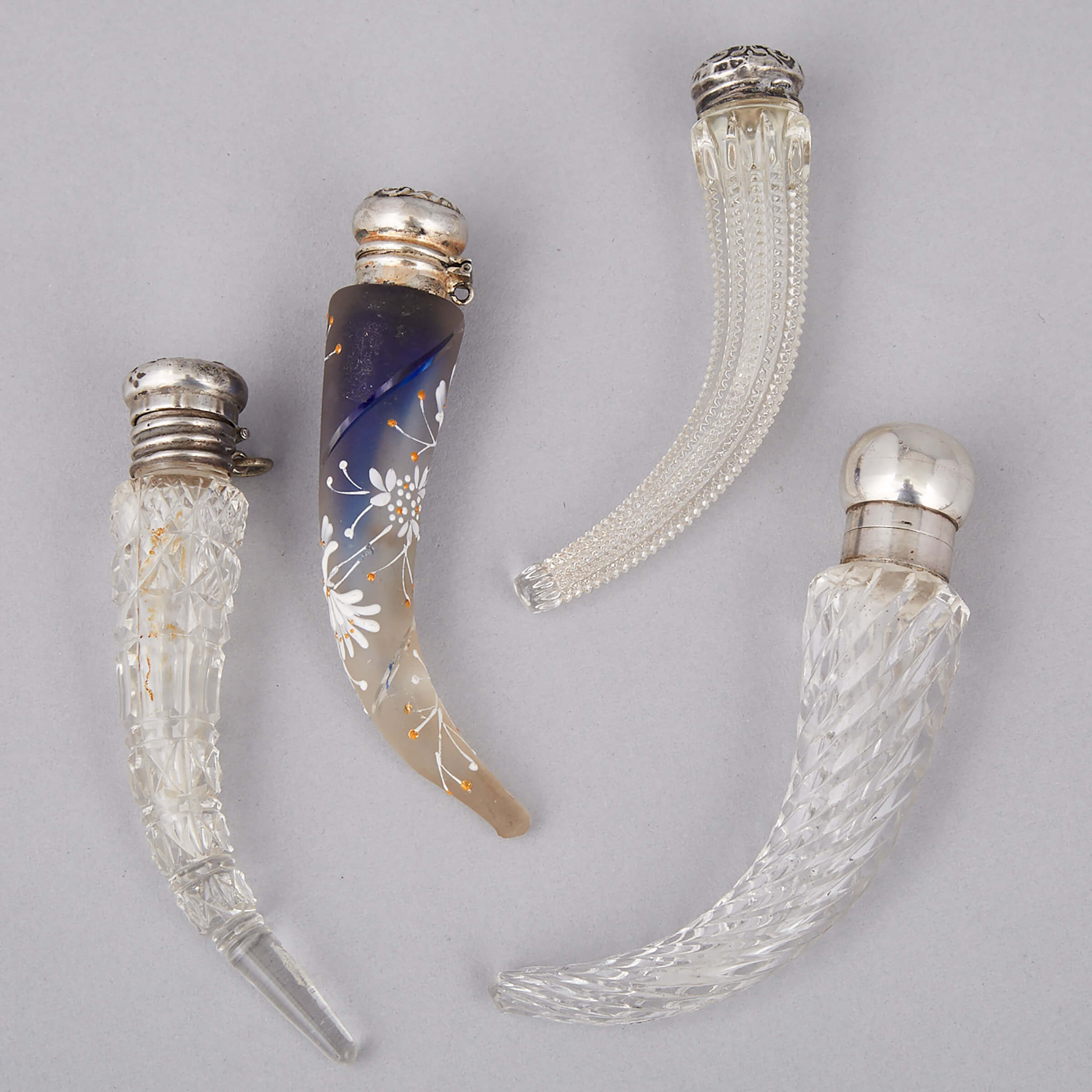 Four Silver Mounted Horn Shaped Cut Glass Perfume Phails, late 19th century