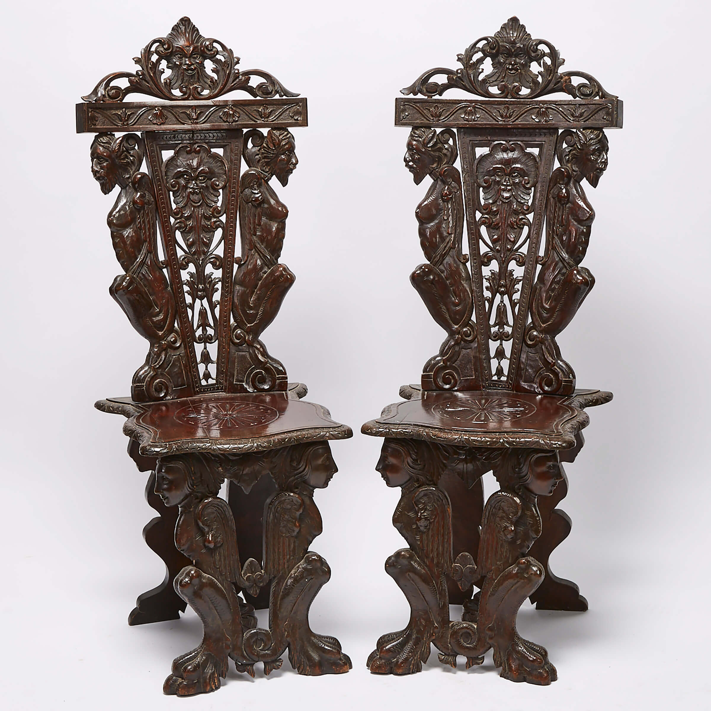 Pair of Victorian Renaissance Style Carved Walnut Hall Chairs, late 19th century