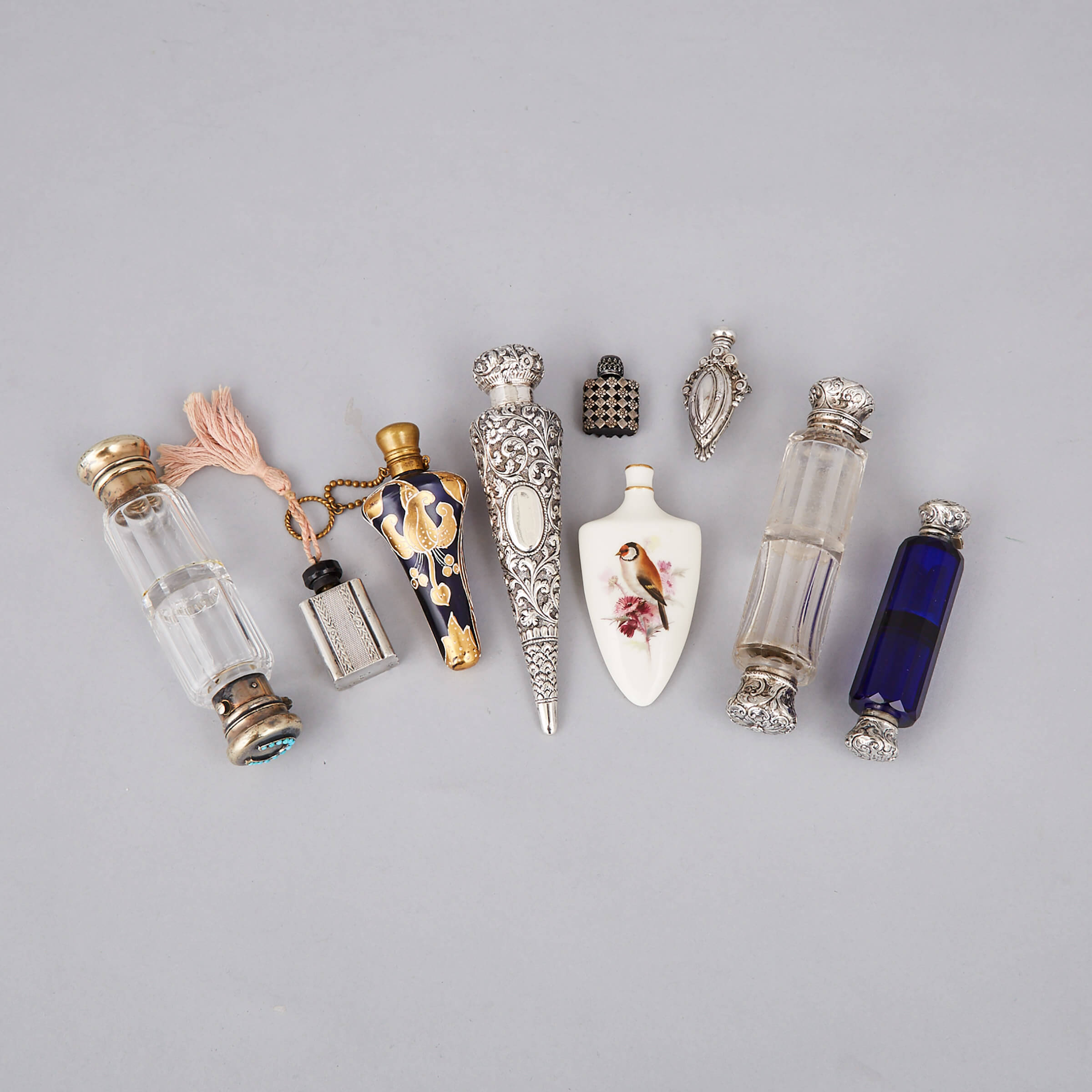Nine Various Silver, Metal, Glass and Porcelain Perfume Bottles and Phials, late 19th/20th century