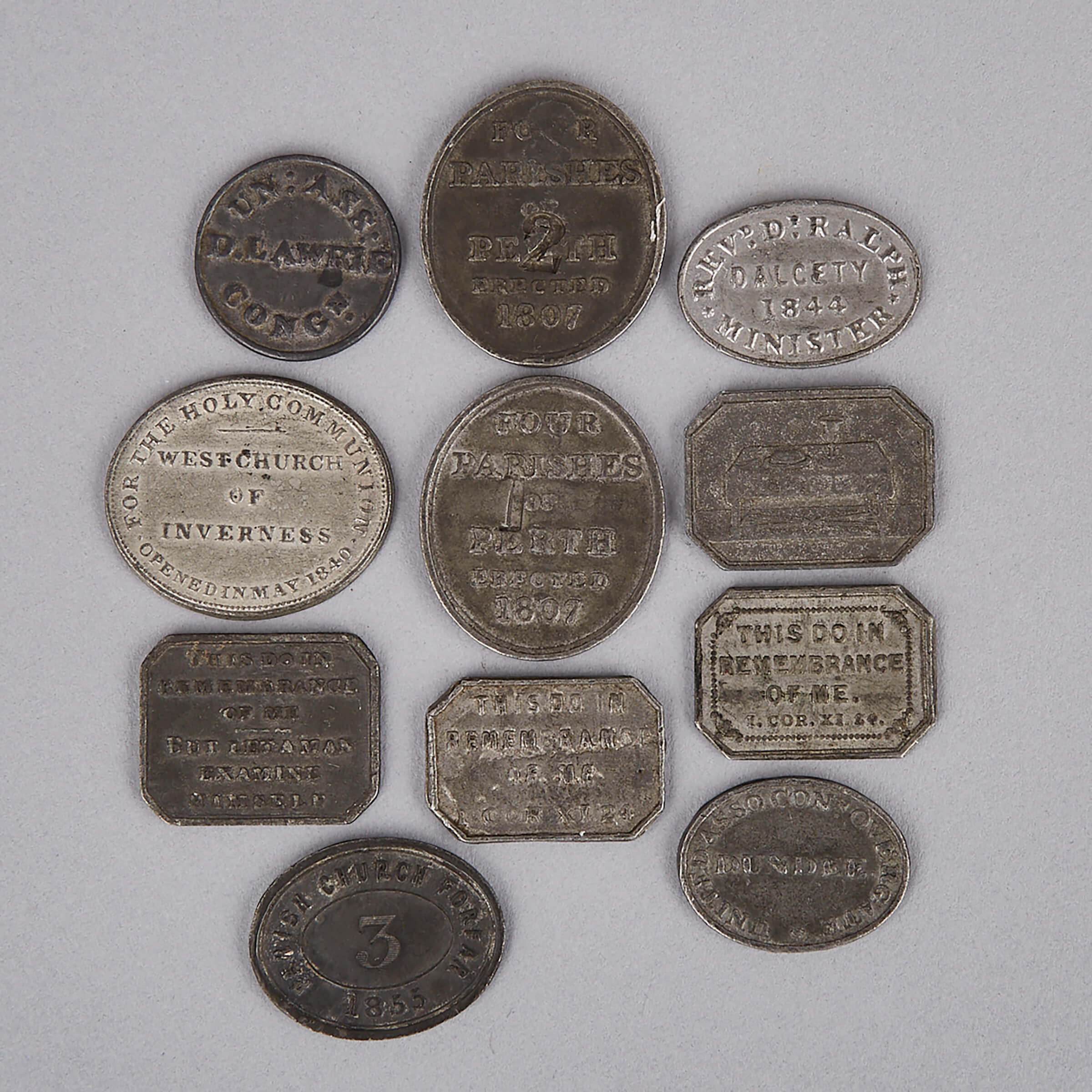 Collection of Eleven Scottish Pewter Communion Tokens, early-mid 19th century