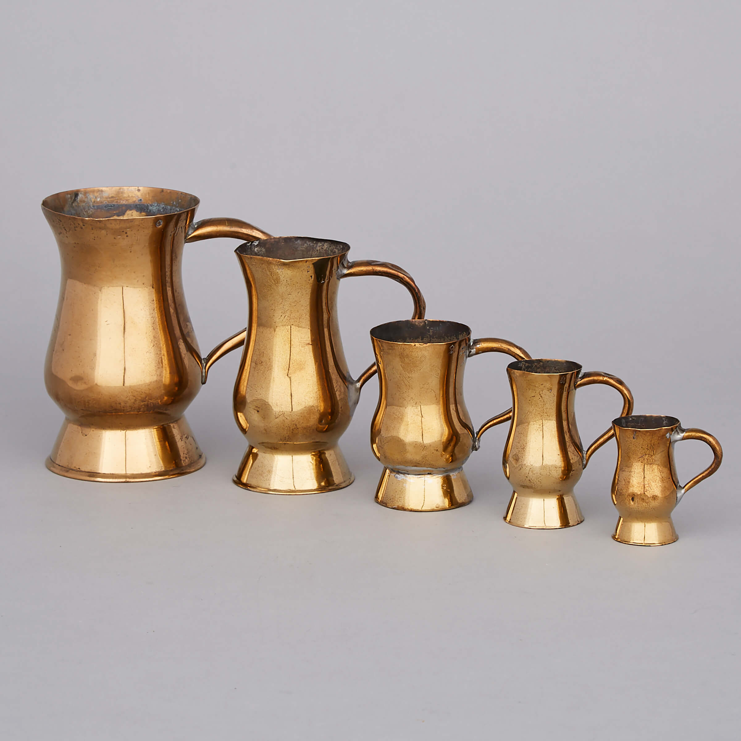 Five Scottish Graduated Brass Baluster Measures, 19th century