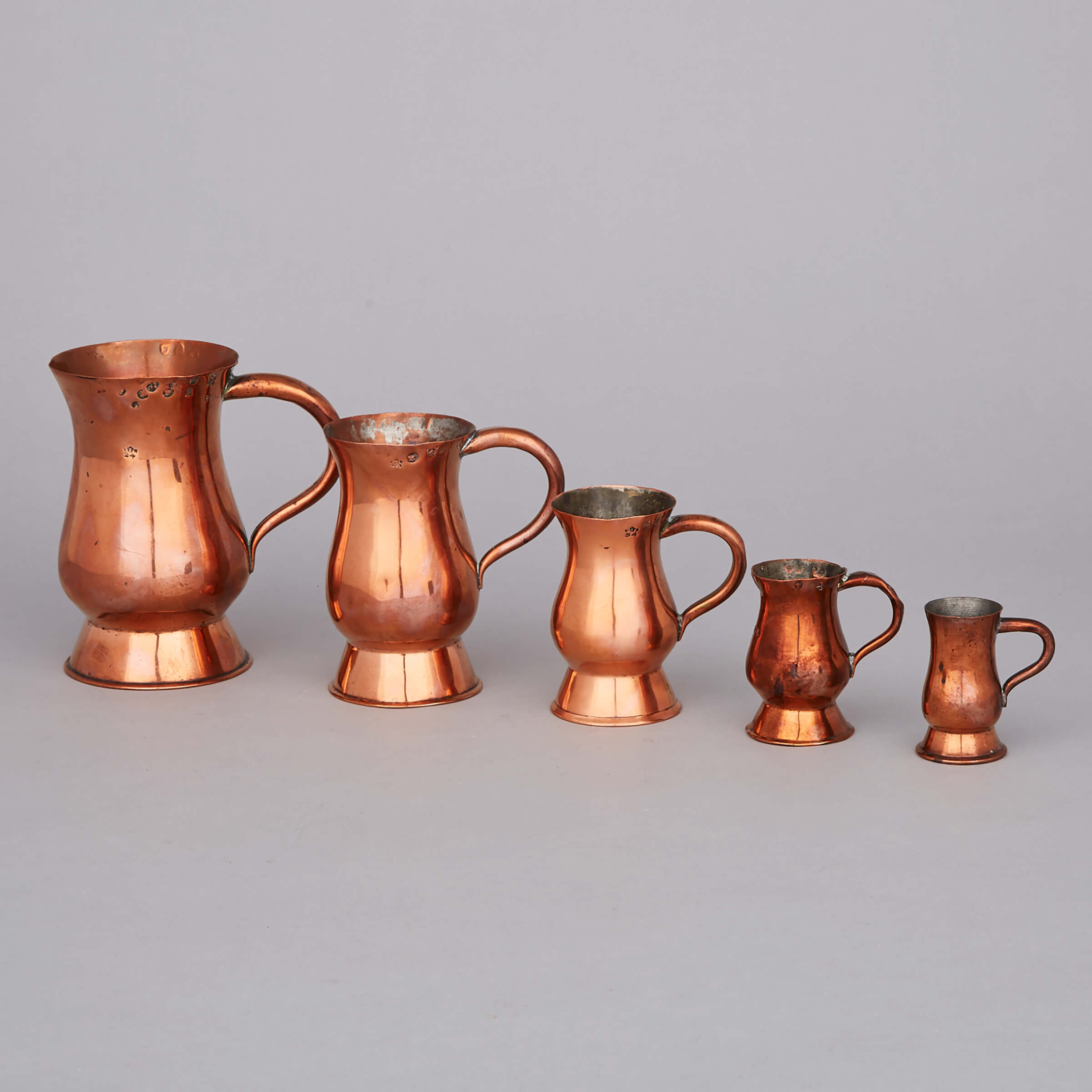 Five Scottish Graduated Copper Baluster Measures, 19th century