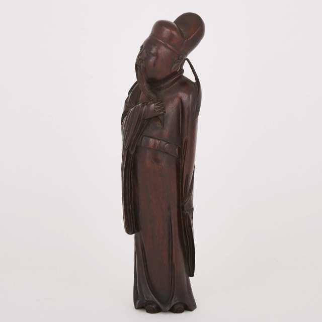 A Hardwood Carved Figure of a Scholar