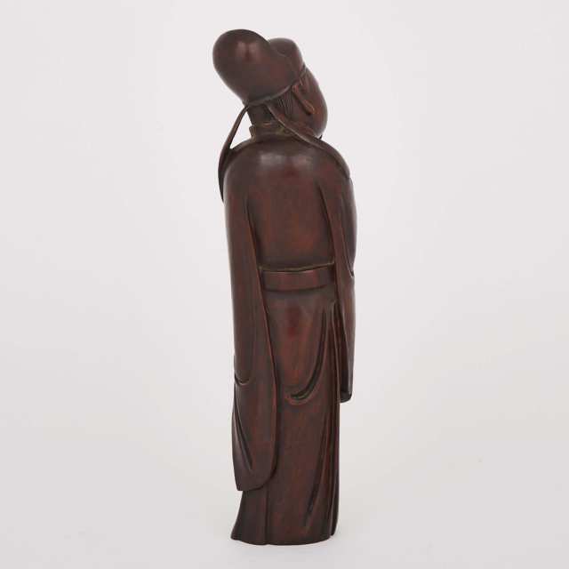 A Hardwood Carved Figure of a Scholar