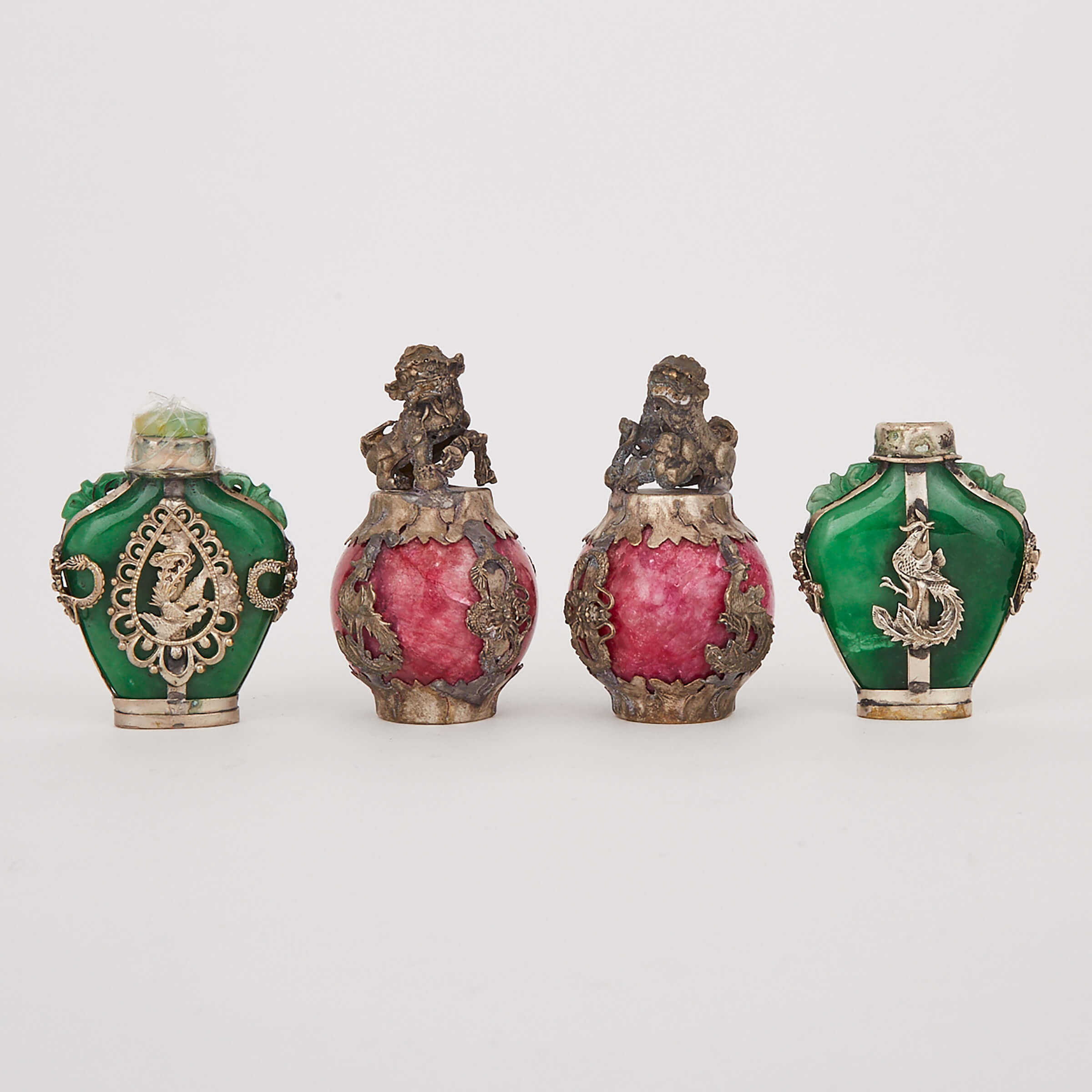 A Group of Four Silver Mounted Baubles