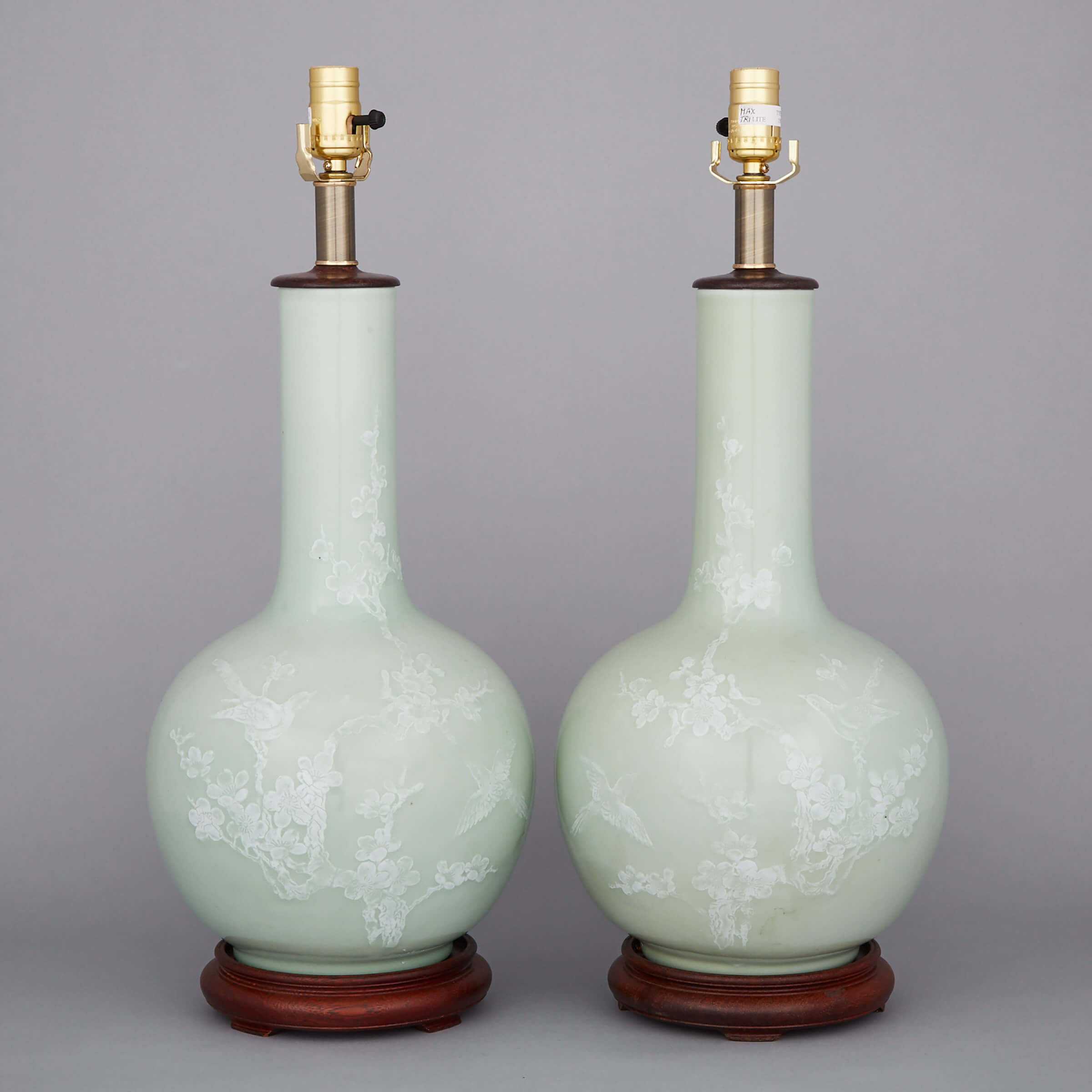 A Pair of White Slip Moulded Vase Lamps