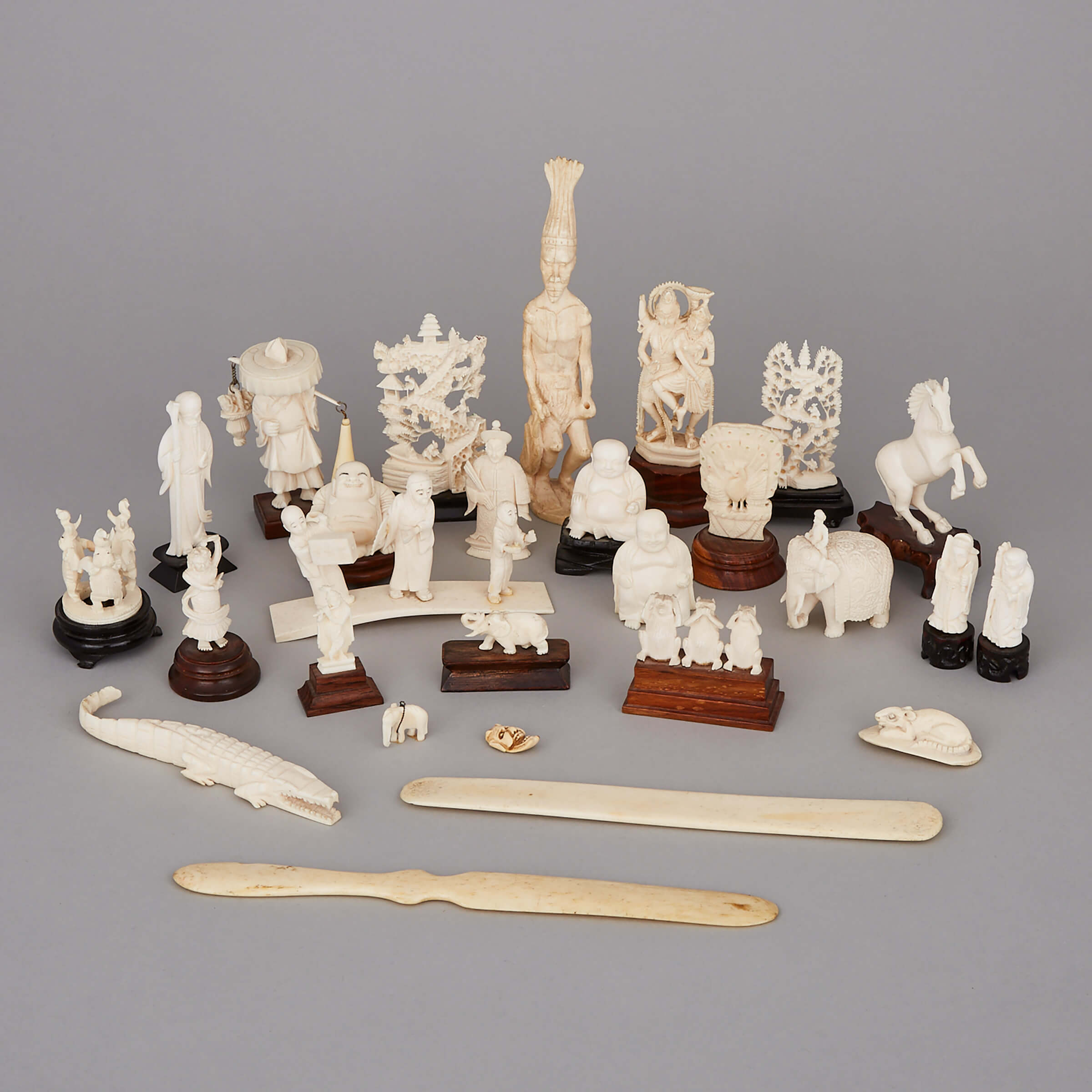 A Group of Twenty-Seven Ivory and Bone Carved Pieces