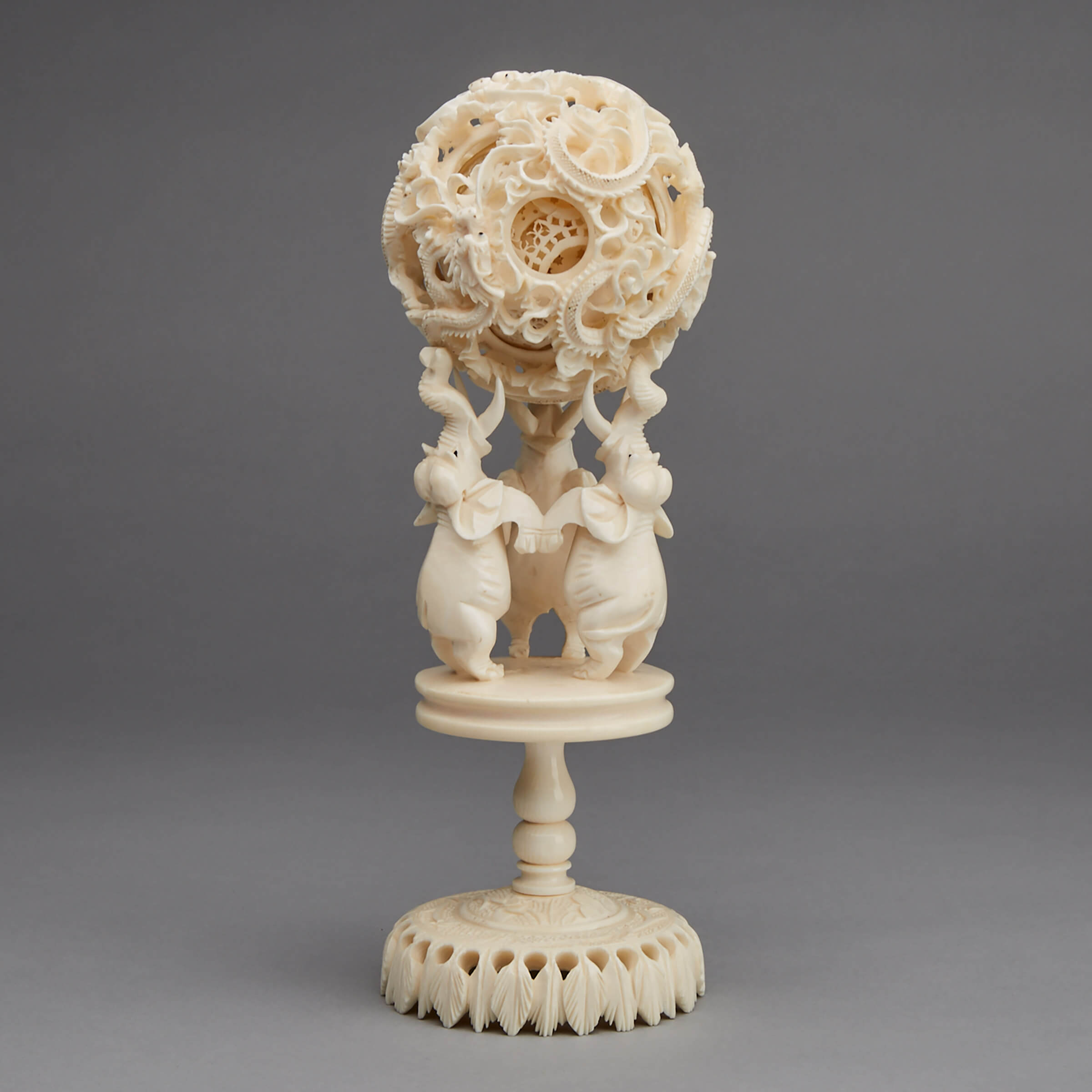 An Ivory Puzzle Ball and Elephant Stand