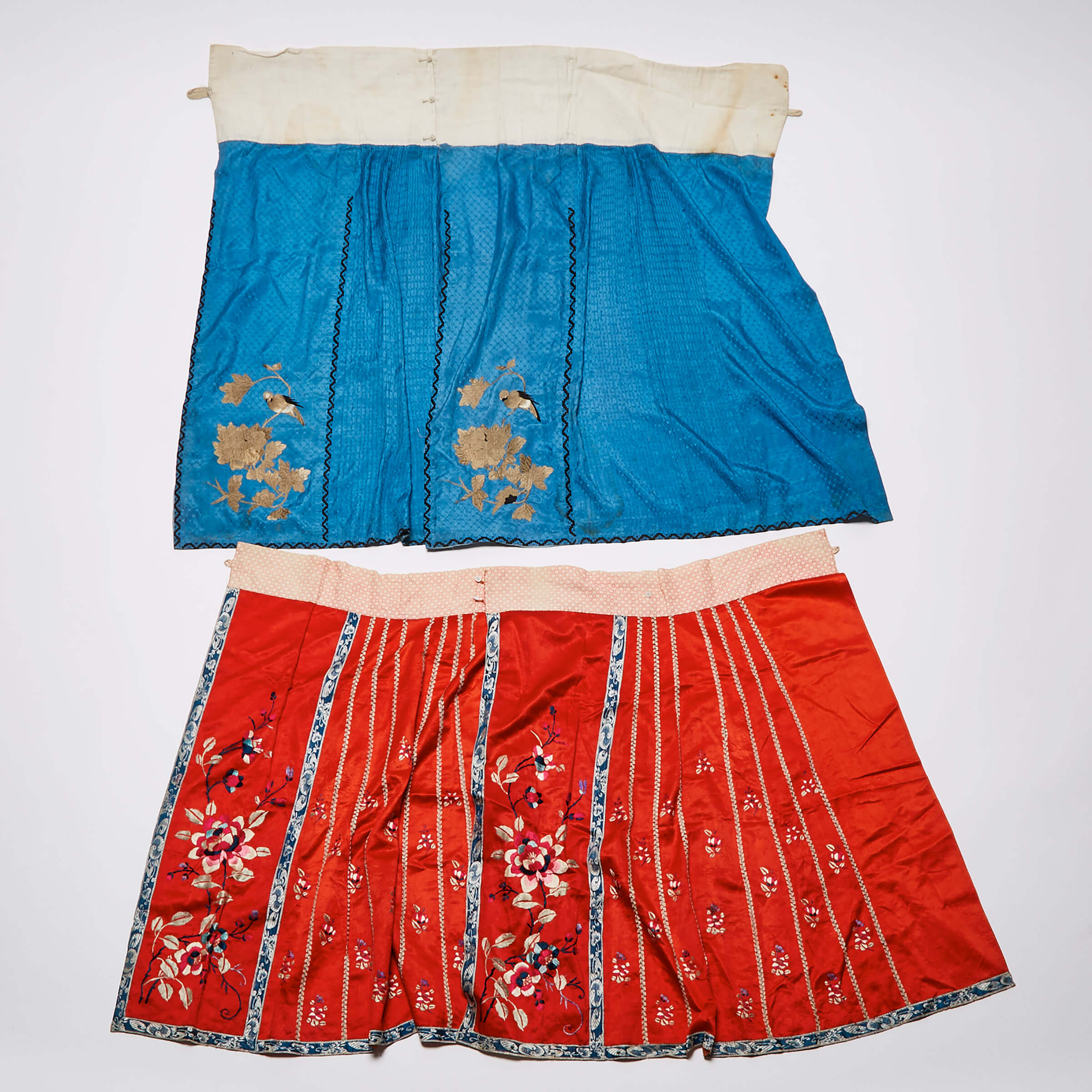 Two Chinese Embroidered Pleated Skirts