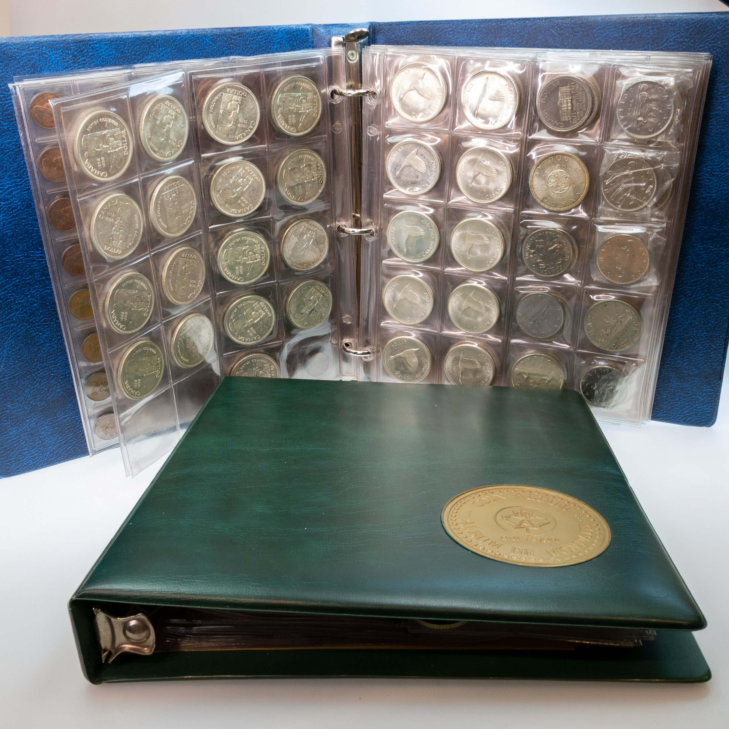 Two Binders Of Canadian Coins And Bank Notes, Etc