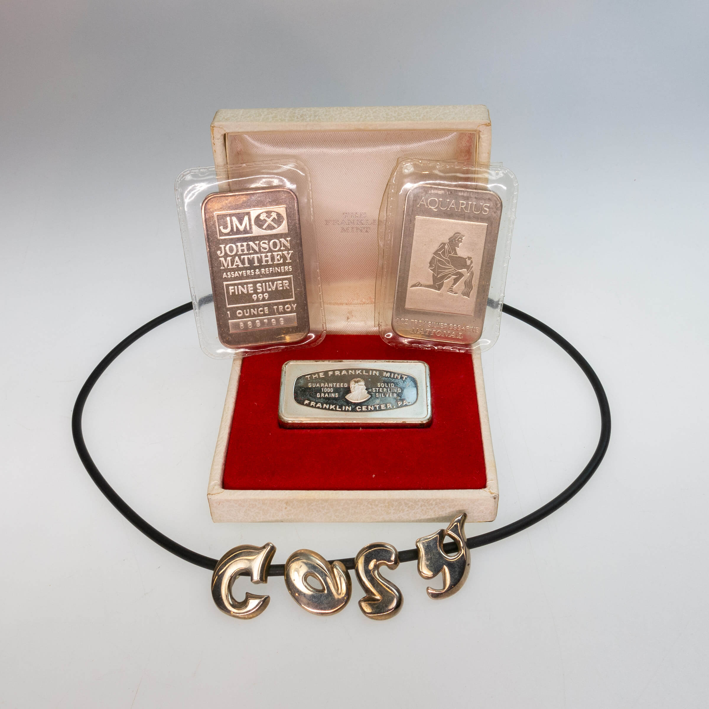 Three Silver Bars And A Necklace