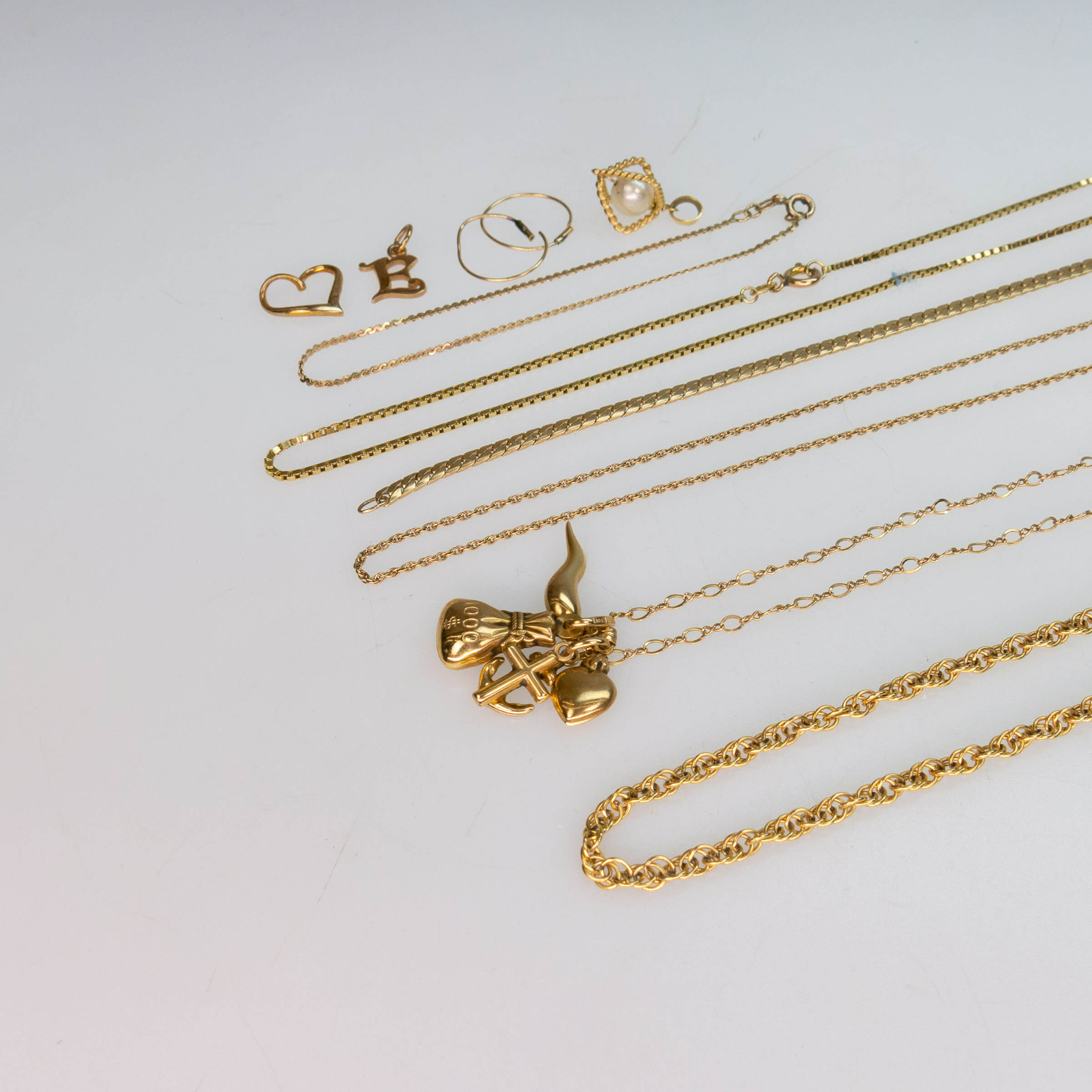 Small Quantity Of Various Gold Chains, Bracelets, and Charms