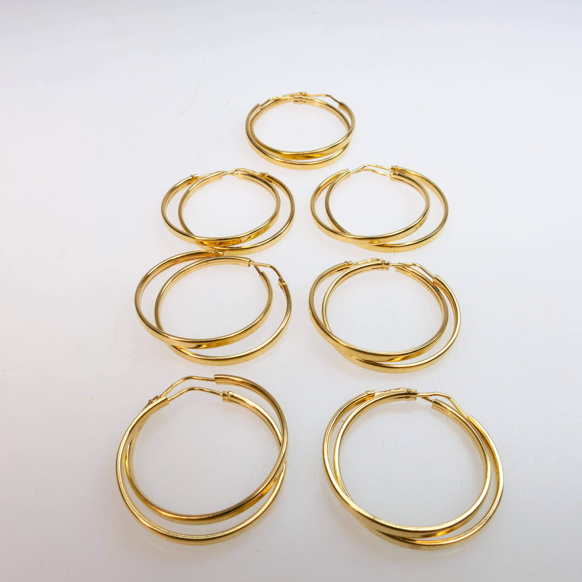 7 Pairs Of 18k Yellow Gold Hoop Earrings