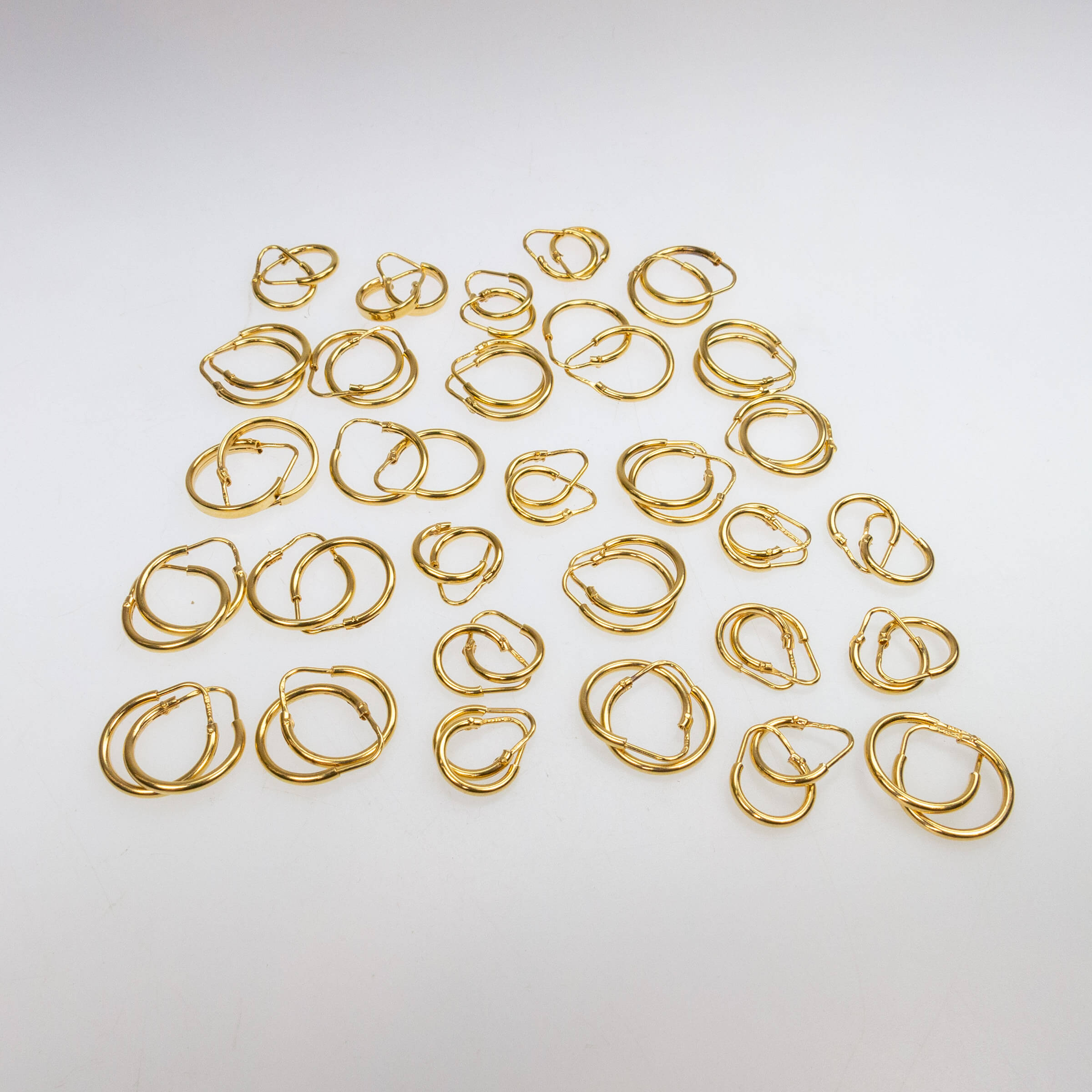 30 Pairs Of 18k Yellow Gold Hoop Earrings