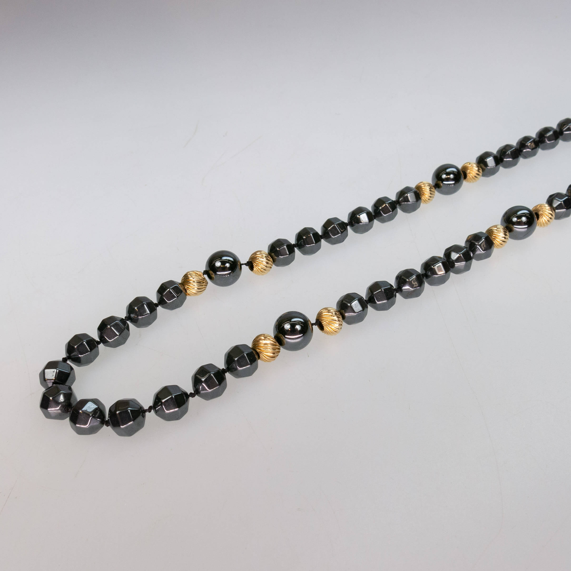 Single Strand Of Facetted Hematite Beads