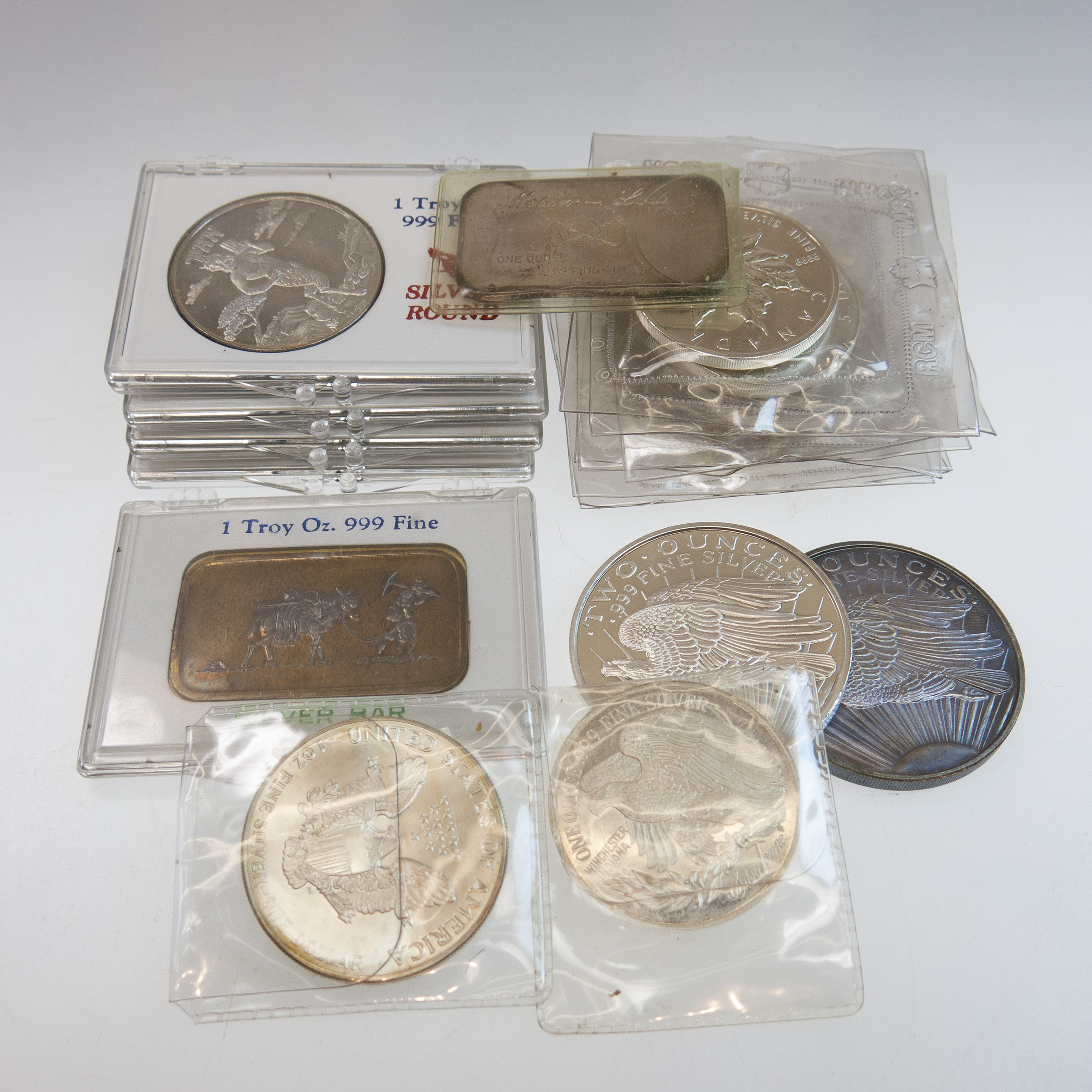 Quantity Of Canadian And American Pure Silver Coins And Ingots