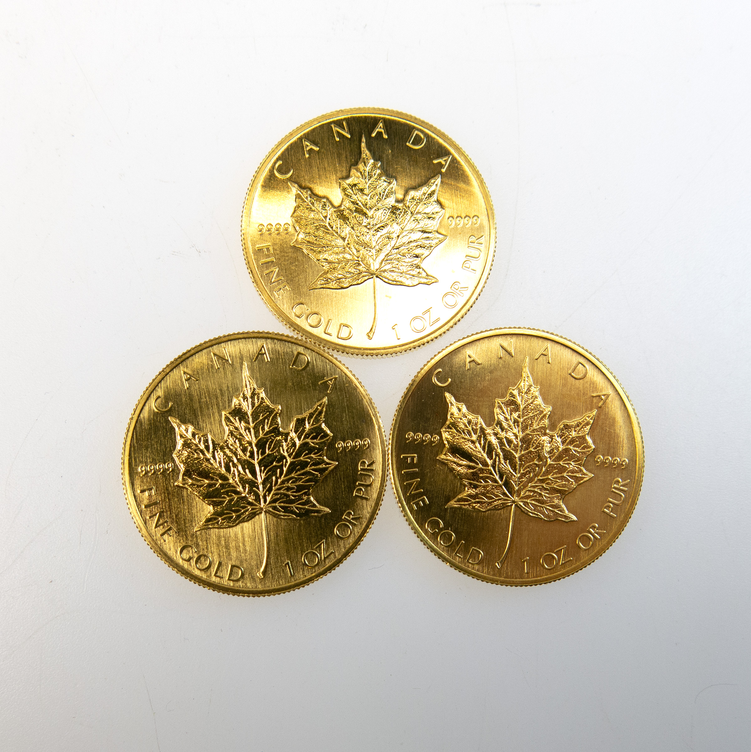 Three Canadian One Ounce Gold Maple Leaf Coins