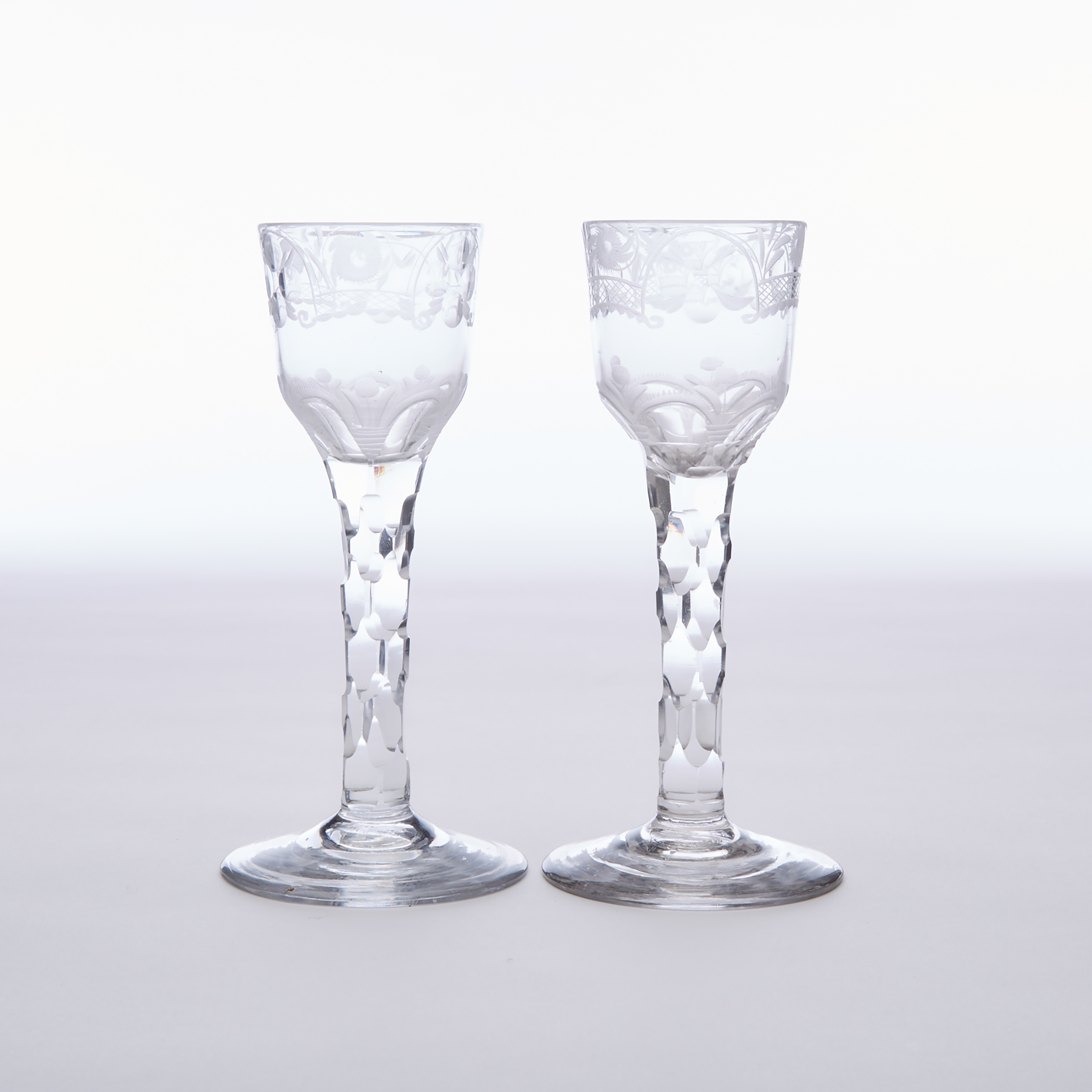 Pair of English Engraved Faceted Stemmed Wine Glasses, c.1765-80