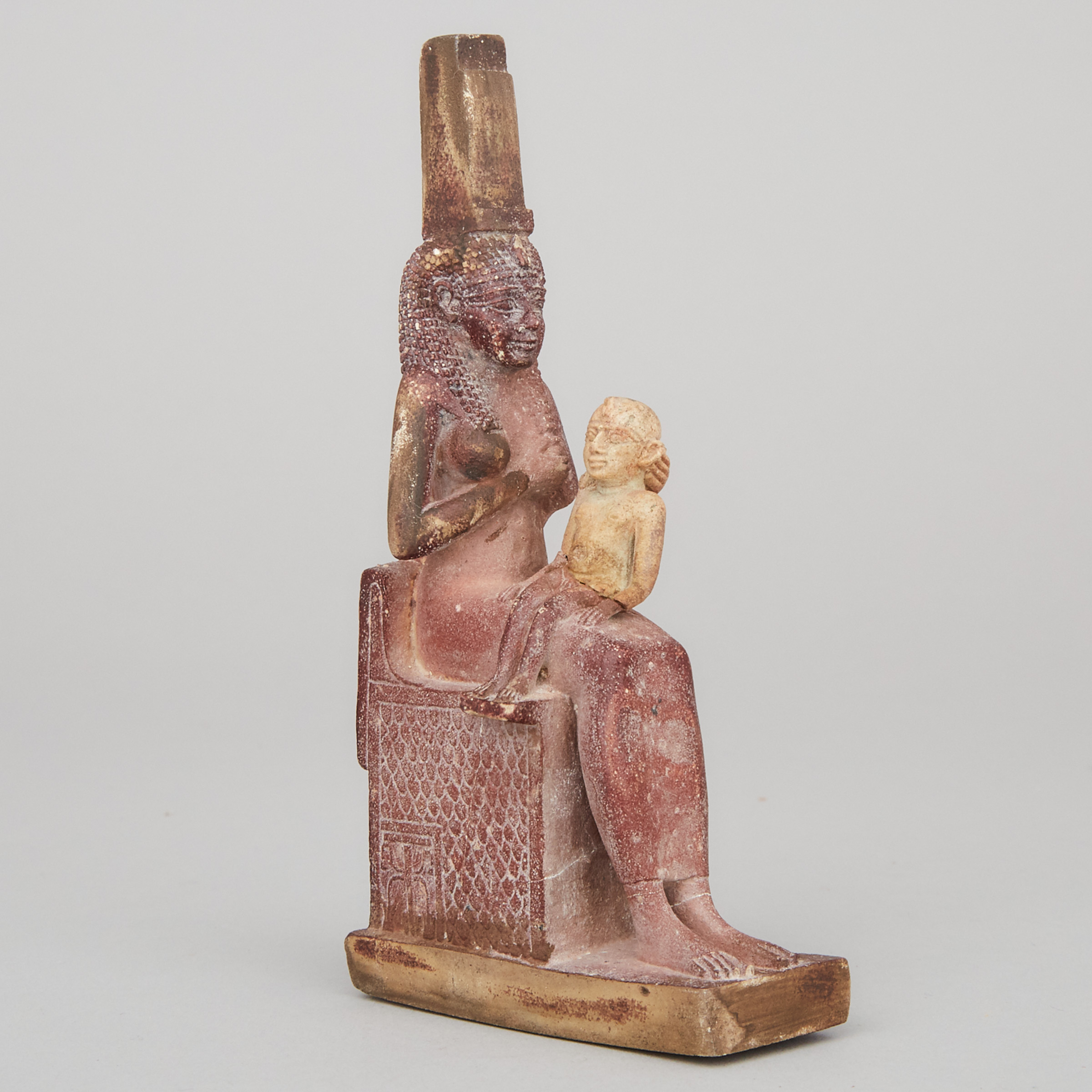 Egyptian Limestone Statuette of Isis Nursing Harpocrates (Horus), Ptolemaic Period, 332–30 B.C.