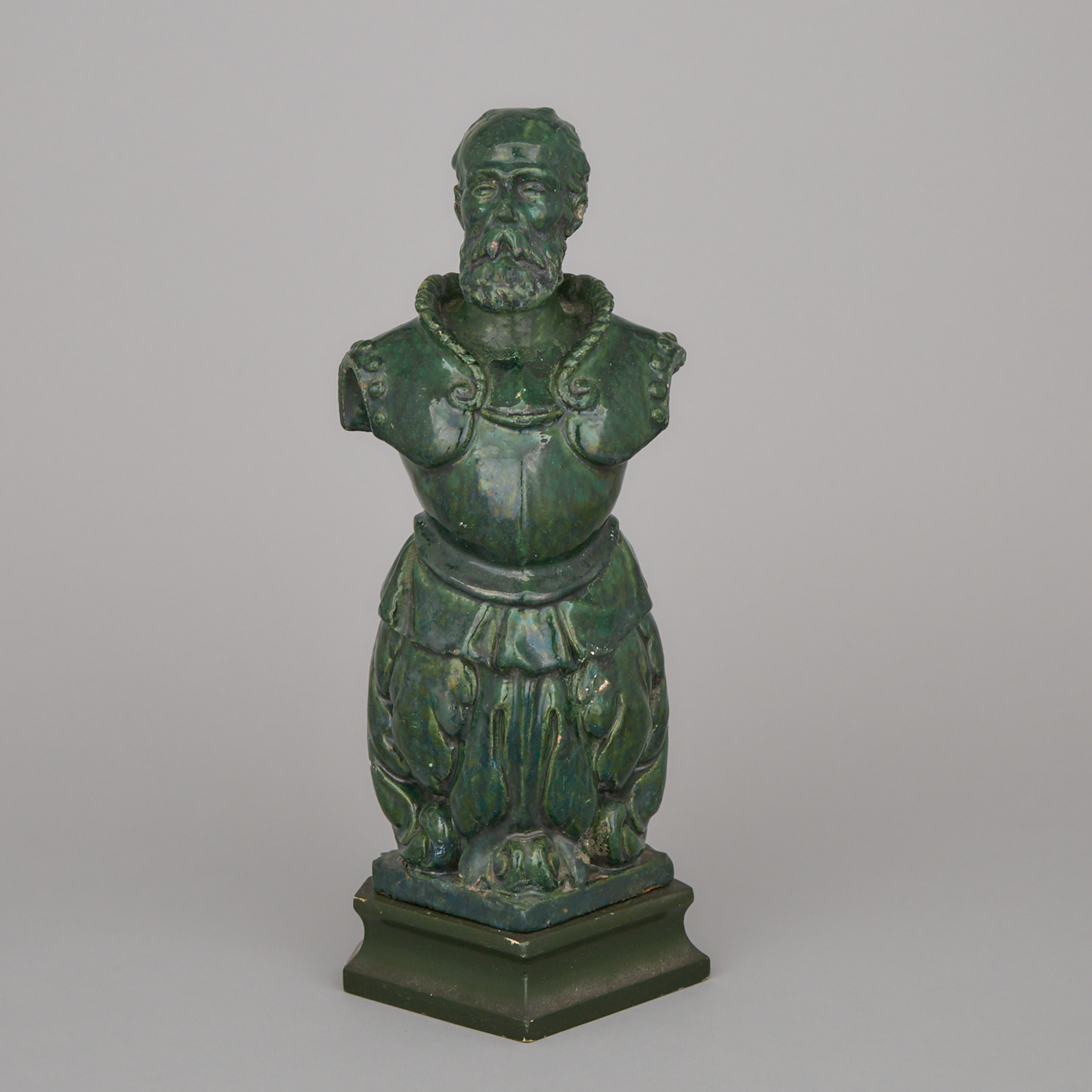 Continental Green Glazed Terra Cotta Figural Antefix, 19th century
