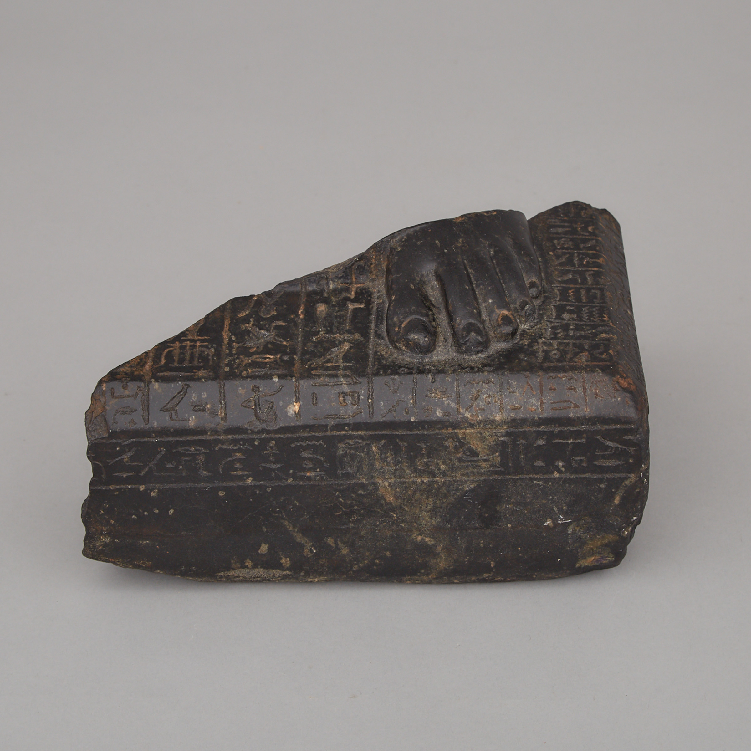 Egyptian Basalt Fragment of a Priest of Horus Healing Statue, Late Period-Ptolemaic Period, 7th-2nd century B.C.