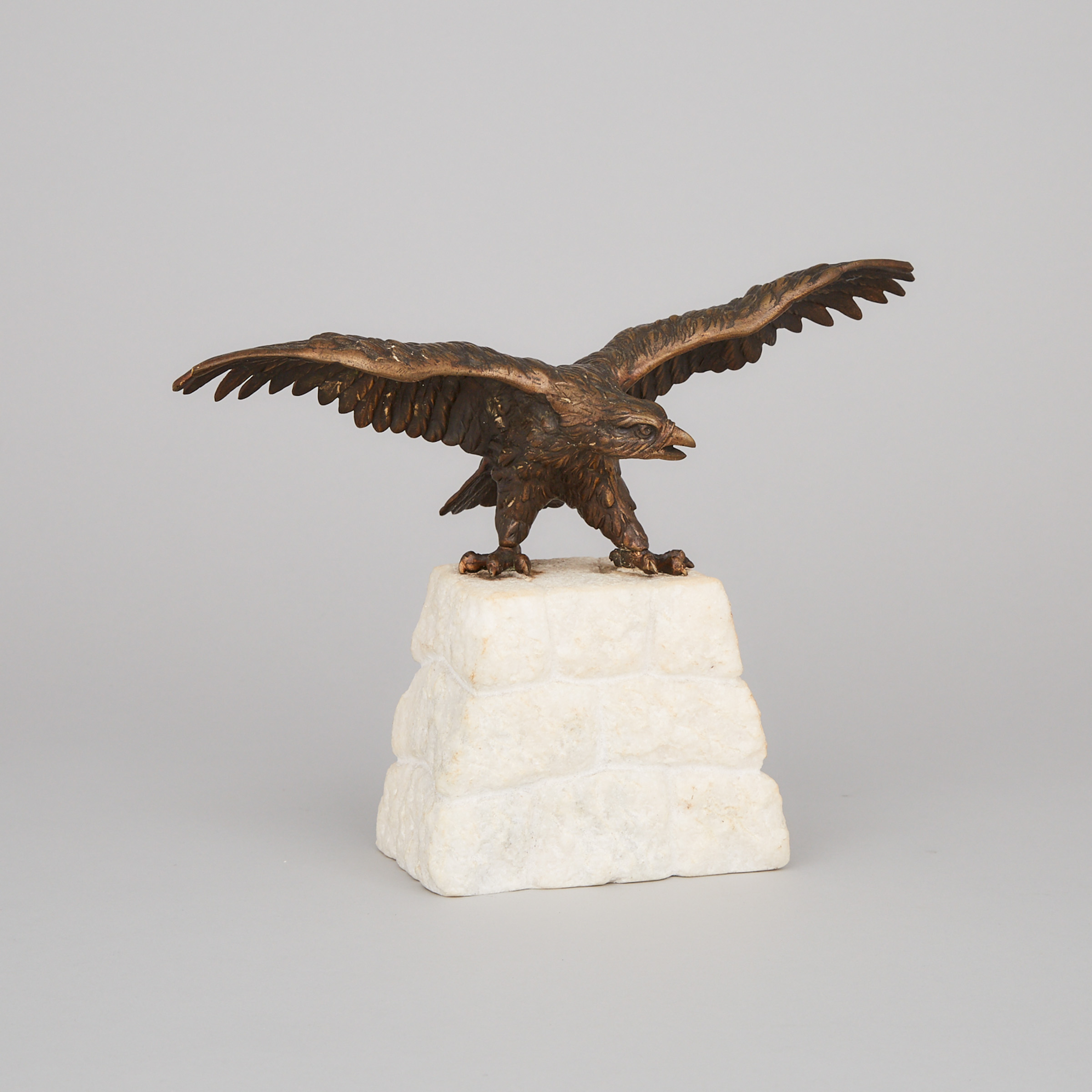 Patinated Bronze Model of an Eagle on a Carved Stone Plinth, early 20th century