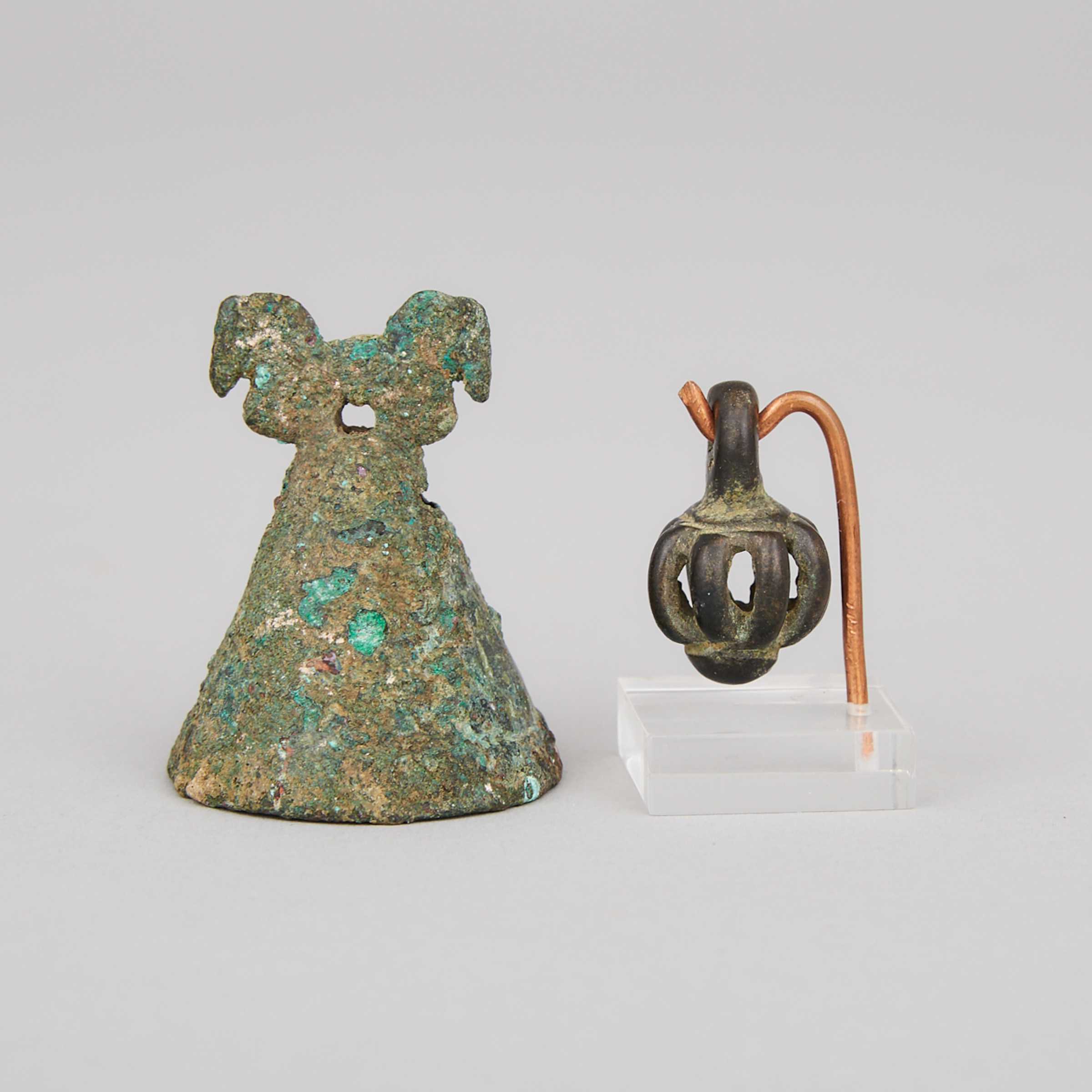 Two Small Luristan Bronze Pendant Bells, Western Iran, 10th-7th century B.C.
