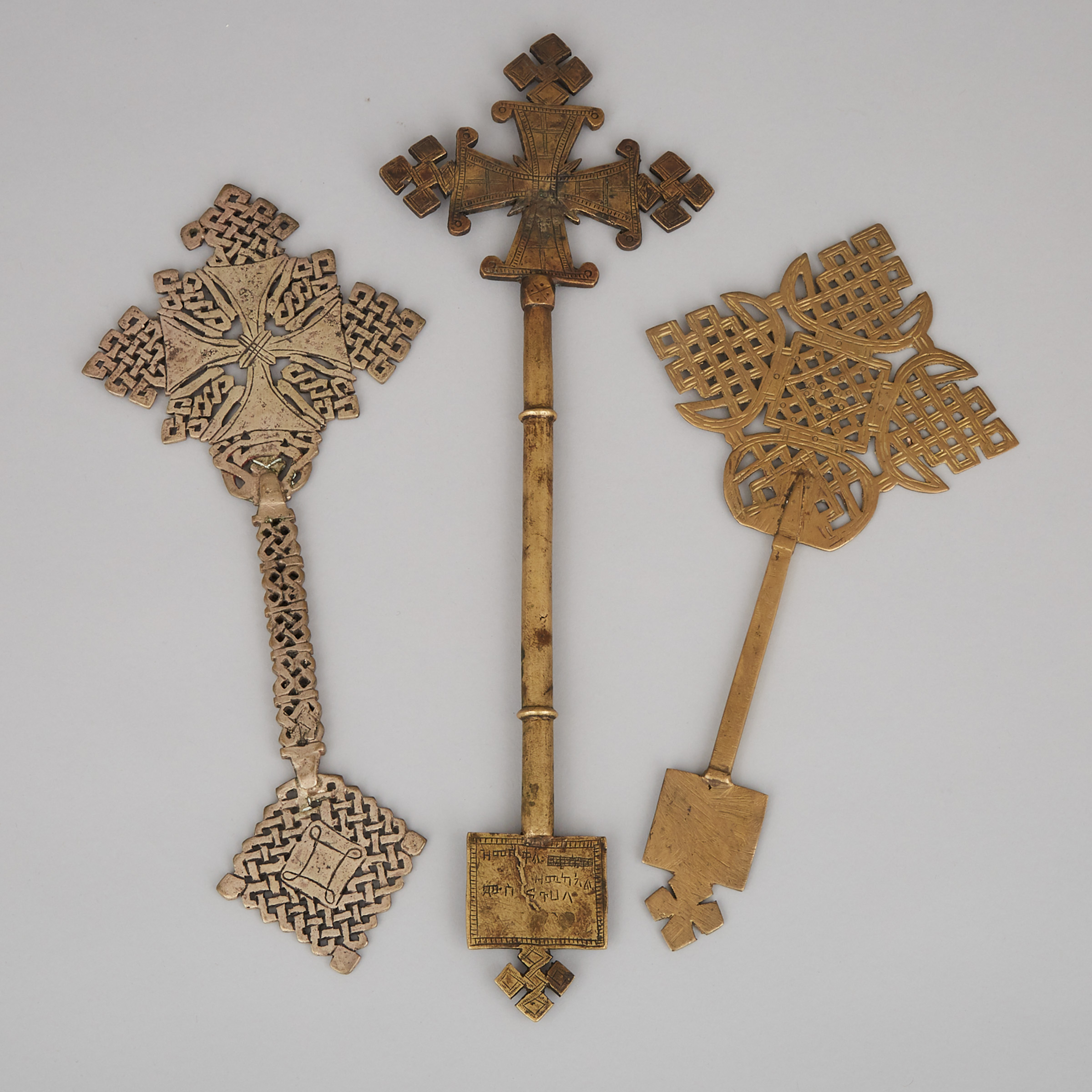 Three Ethiopian Coptic Pierced Bronze Hand Crosses, 19th/early 20th century